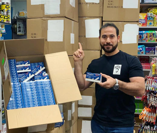 Hazem with boxes full of Covid RATS