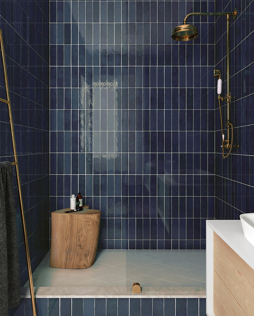 Modern Cobalt Blue Ceramic Tile Shower with Gold and Wood Accents