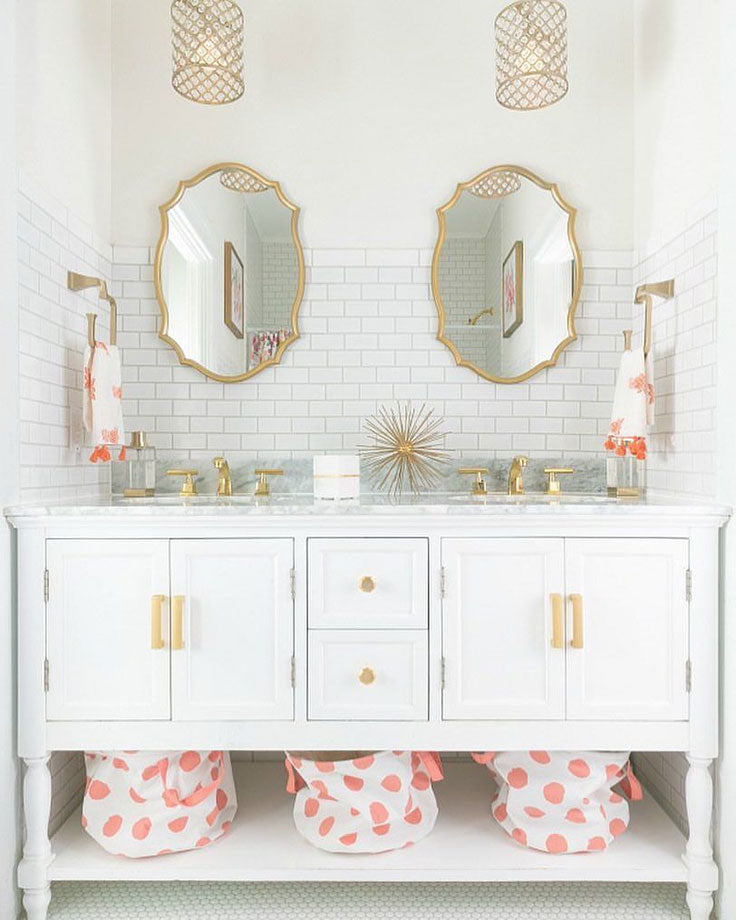 Adorable White Vanity with Gold Framed Mirrors and White Glass Subway Tile Backsplash