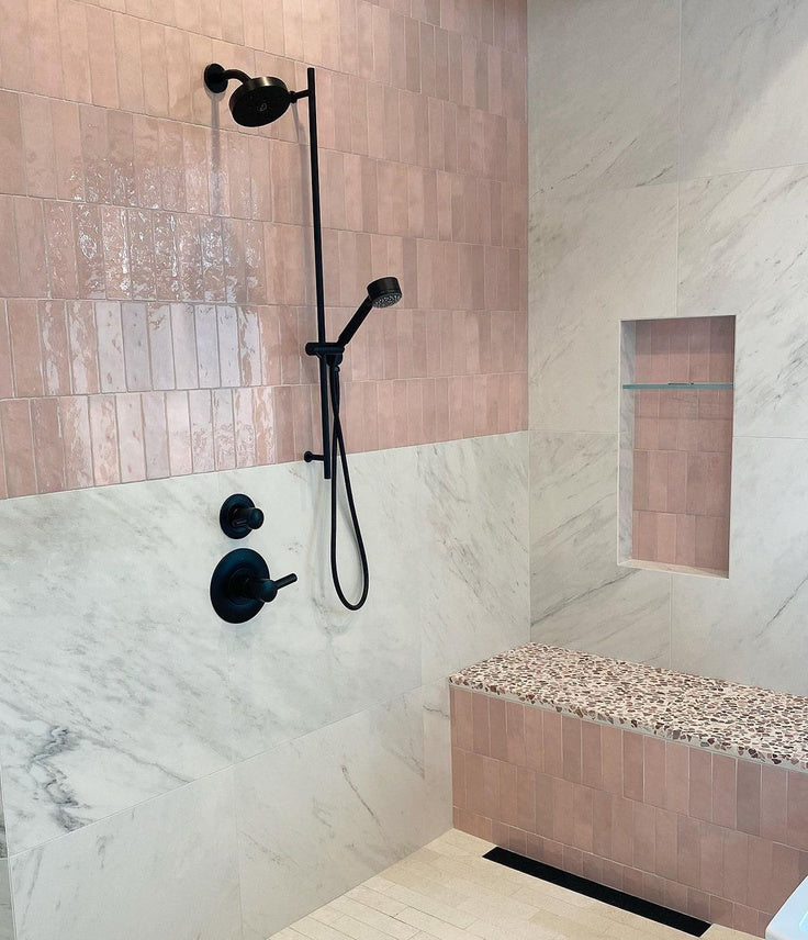 Pink Ceramic Subway Tile Shower with White Marble and Terrazzo details