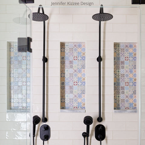 White ceramic subway tile shower with colorful Moroccan tile niche decor