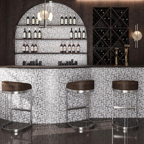 Wood paneled wine bar with Silver White Sticks Marble Mosaic Tile accents and niche