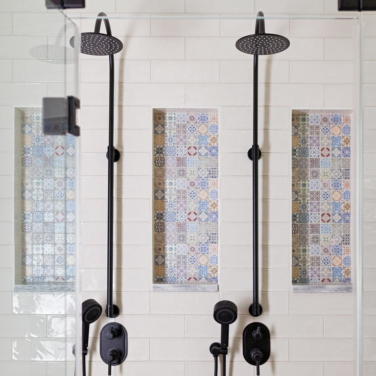 White ceramic shower tile with colorful mosaic niche tiles