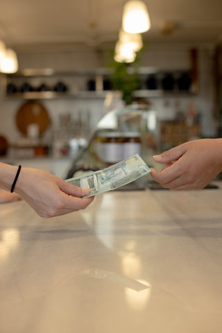 two people exchanging money