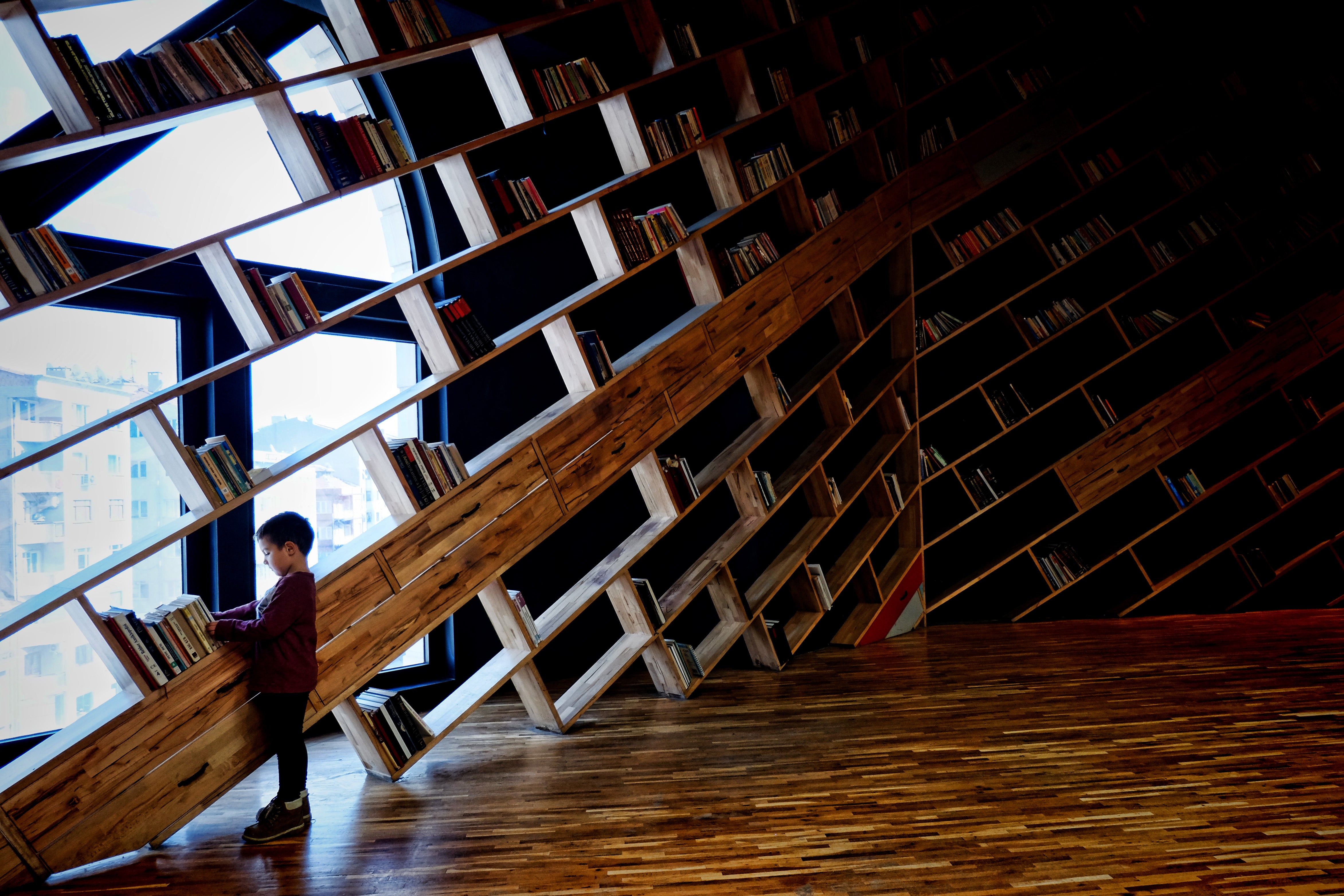 kid in a book library