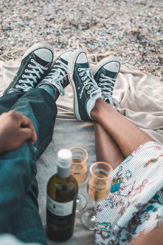 couple holding wine glass