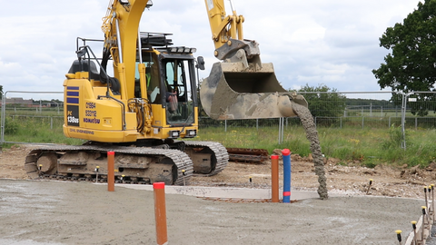 Rhinox concrete pouring bucket pouring a concrete slab for a house