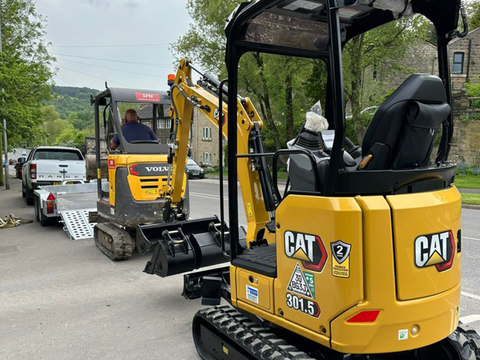 Howard Plant Sales working with a customer to trade a used excavator for a new one.