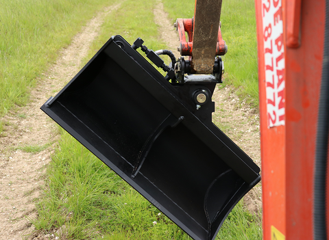 Rhinox tilt grading bucket, tilted 45 degrees to the left, directly mounted to a kubota digger