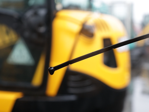 Oil dipstick being checked on a JCB excavator