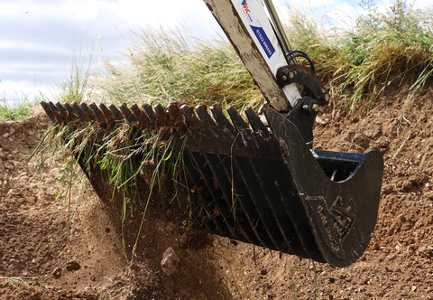 Rhinox rake riddle bucket separating grass from smaller materials