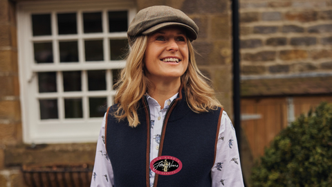 Lady wearing tweed cap, shirt and gilet