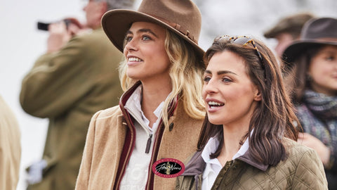 2 Ladies watching the horse racing