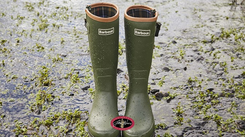 Barbour Wellington Boots in a rain soaked field