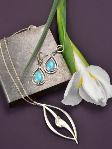 silver earrings and silver floral inspired pendant Nikki Lorenz Designs