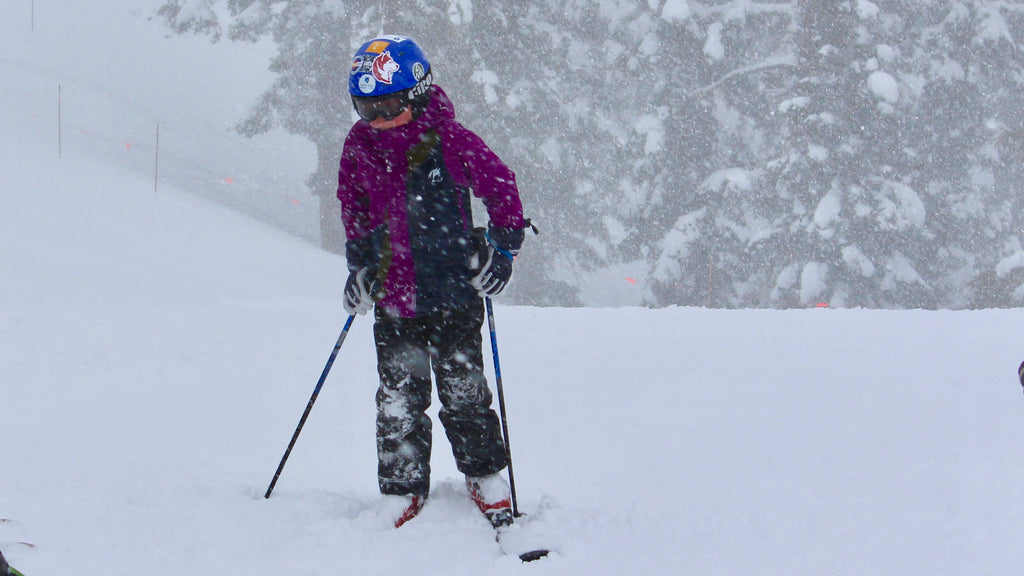 Young skier in SHRED DOG gear ready to hit the slopes