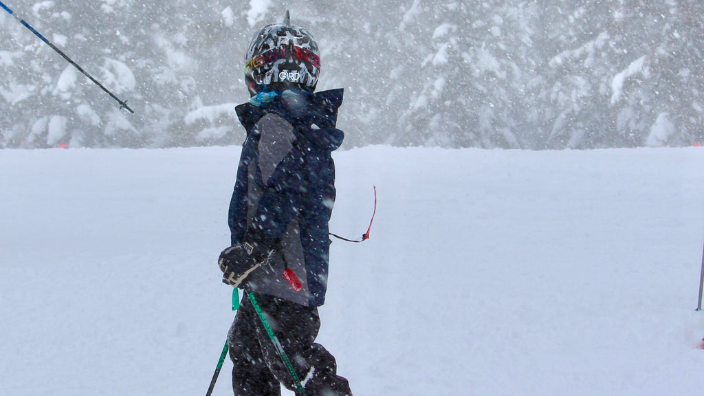 Young skier on the slopes in SHRED DOG kids winter gear