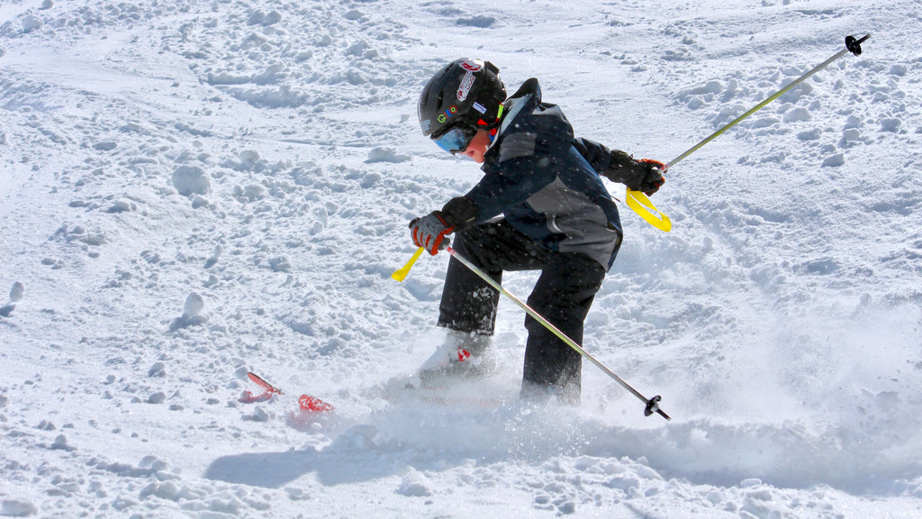 Young skier carving