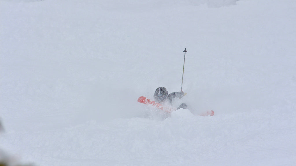 Young skier taking a small fall