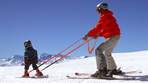 A kids ski harness in use