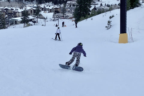 kid snowboarding catching toe edge