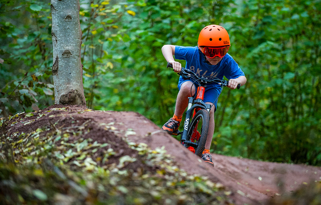 Boy riding a 20"m bike