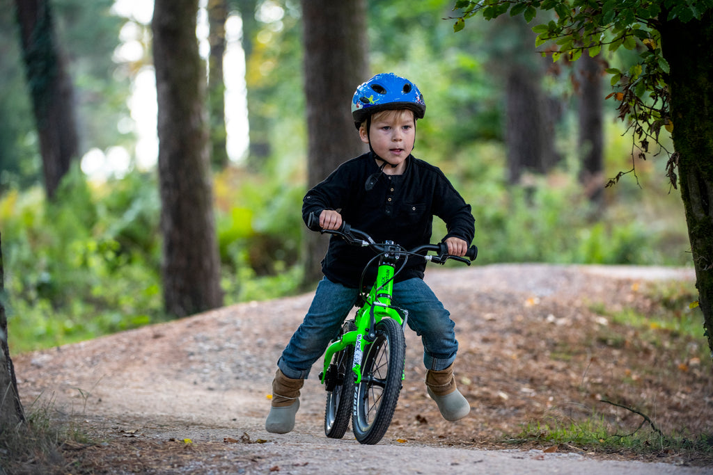Boy riding a balance bike