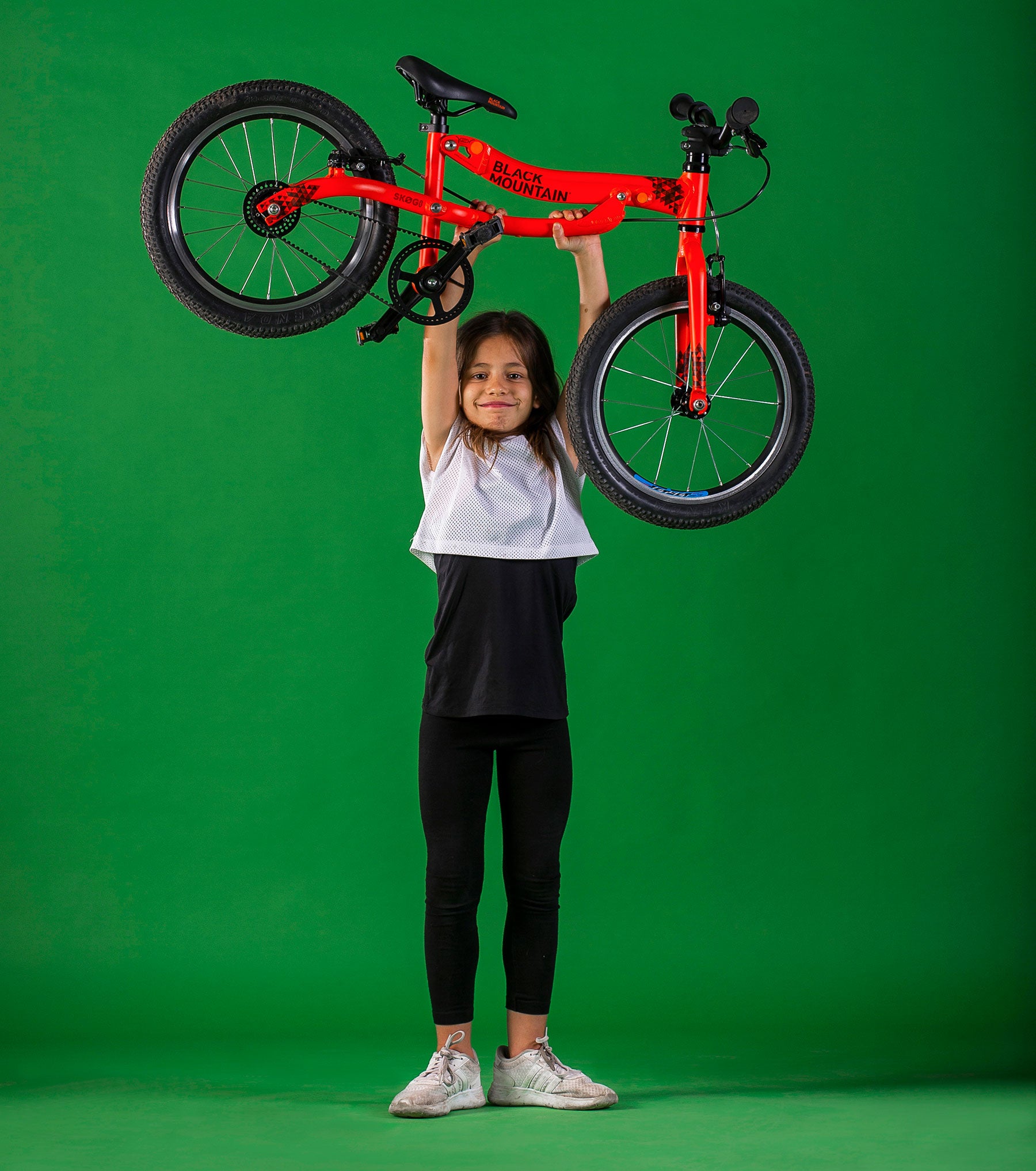 Girl lifting lightweight bike