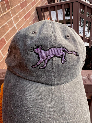 An updated embroidery sample of Faithful on the front of a hat.