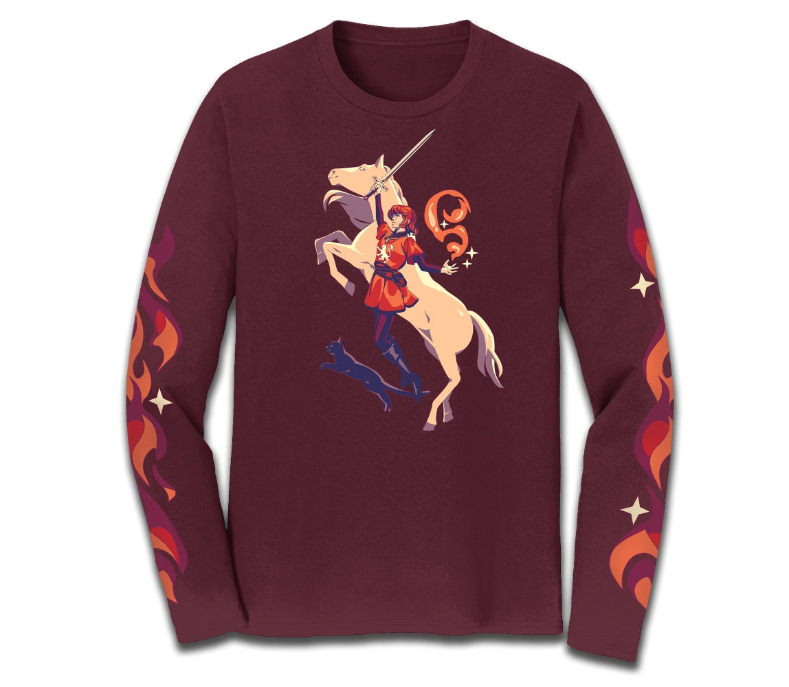 A maroon longsleeved t-shirt featuring Alanna leaping with Moonlight the horse and Faithful the cat, with orange and red flame magic details up the sleeves.