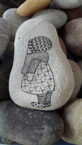 Painted rock little girl ink and pen by artist Ineke Burgman of the Netherlands