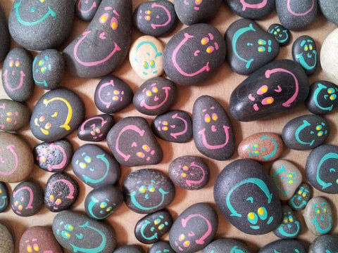 First rocks painted by USA artist Bethany Kirwen, smiley faces for children