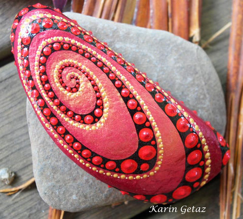 red mandala swirl painted rock magic karin getaz