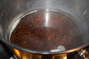 Heat off, the hot break and vigorous boil have made the wort look like egg drop soup