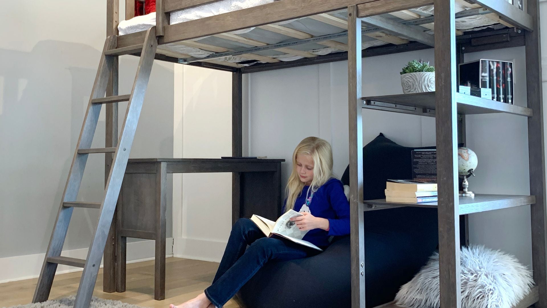 desk underneath loft bed and storage shelves