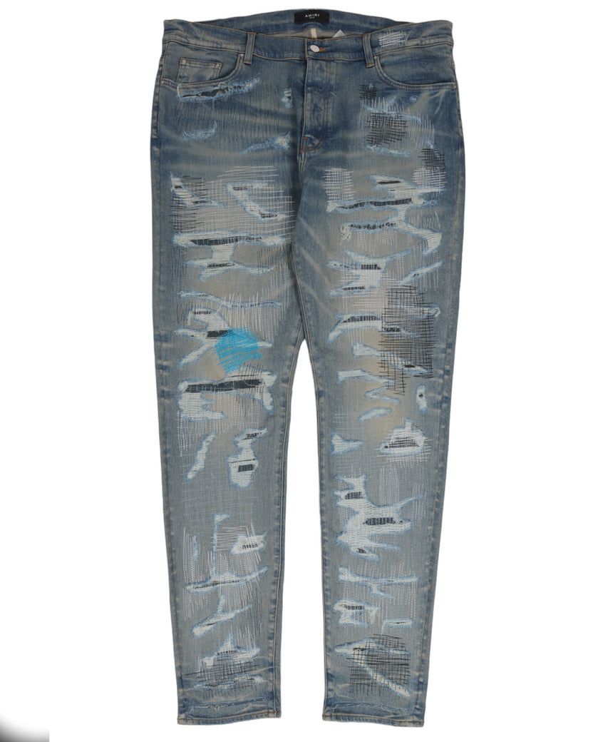 Amiri All-Over Repair Denim