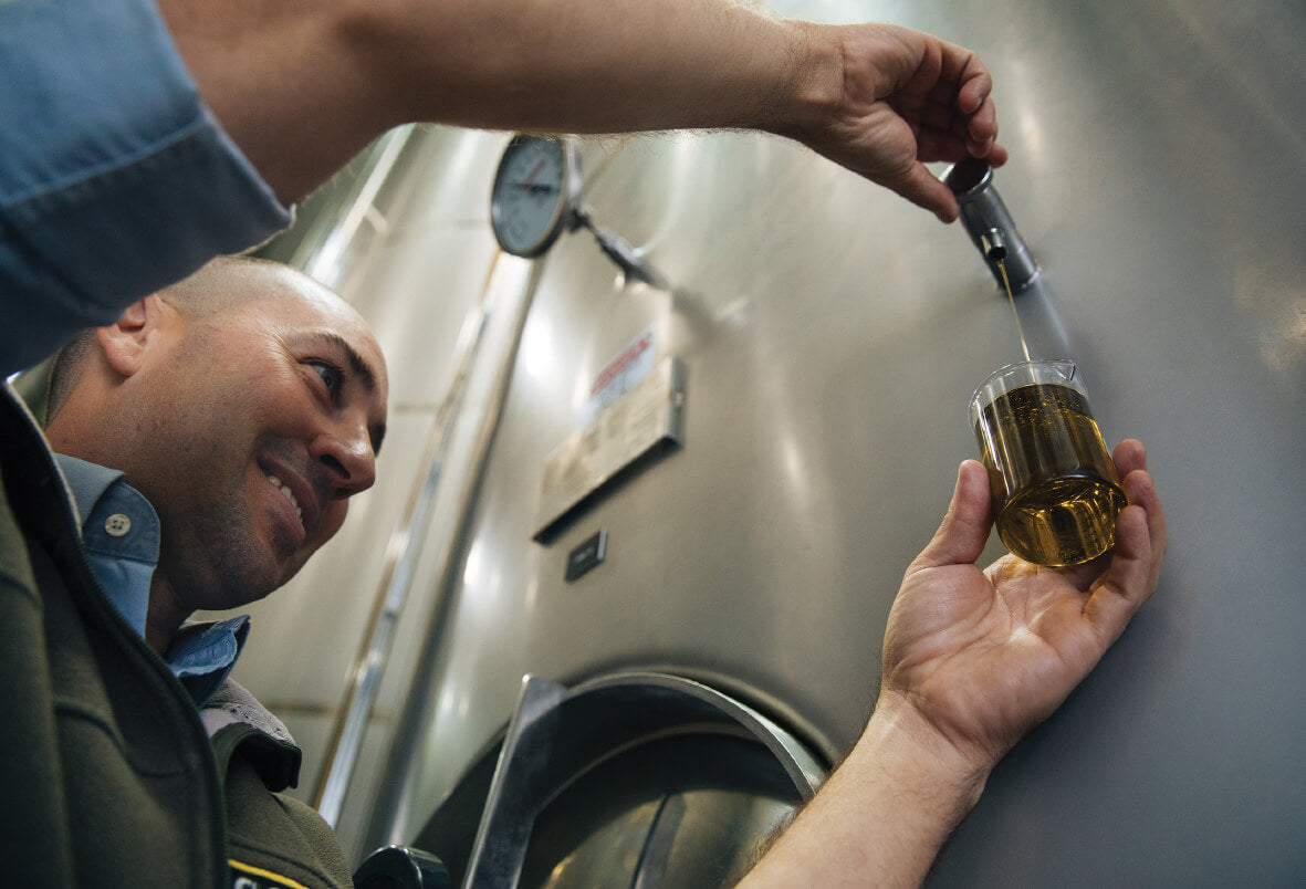 man testing olive oil