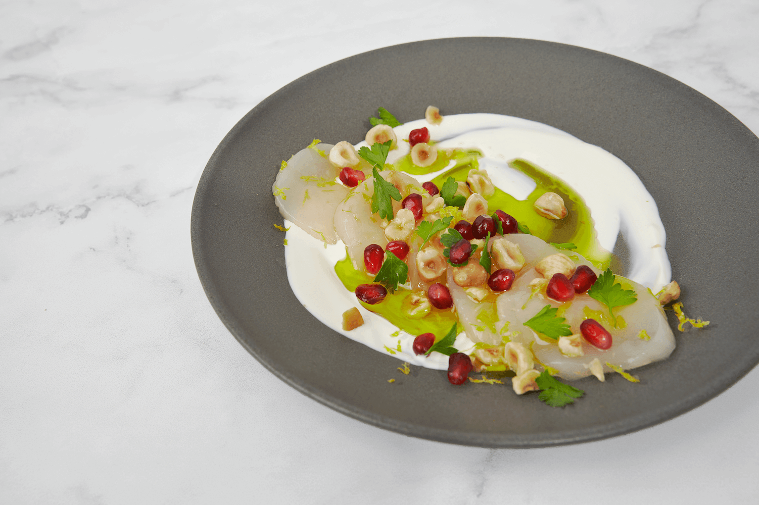 Scallop Crudo with Crème Fraîche, Pomegranate and Lemongrass & Basil Olive Oil