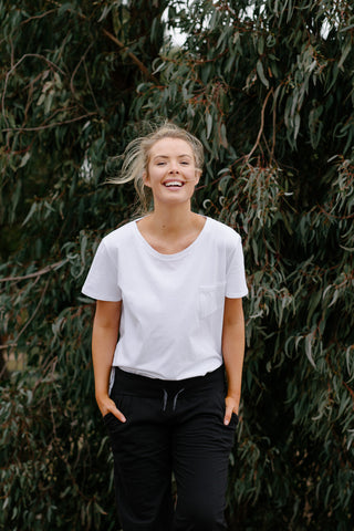 Woman laughing in white organic cotton tshirt