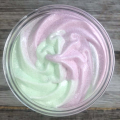 A swirled green and pink sugar scrub by Good Williams