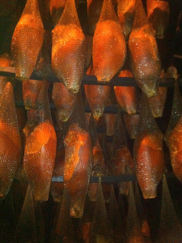 Hams hanging in the smokehouse