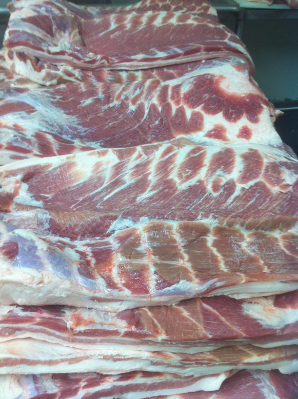 Fresh slabs of bacon, ready for the curing process!