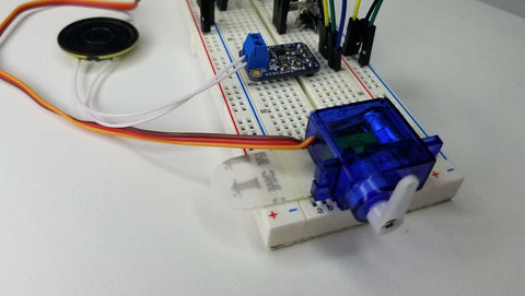 Breadboard circuit with servo, amplifier, and speaker