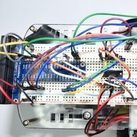 Breadboard circuit mounted to robot chassis