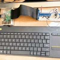 Keyboard, Raspberry Pi connected to breadboard circuit via header and wedge