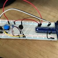 Breadboard circuit with switches, pizeo speaker, and jumper wires