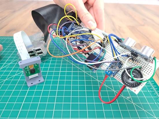 Breadboard circuit including servo, amplifier, accelerometer, speaker, and GPIO header