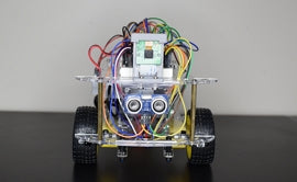 Raspberry Pi and Python Robot Sitting on Dark Desk