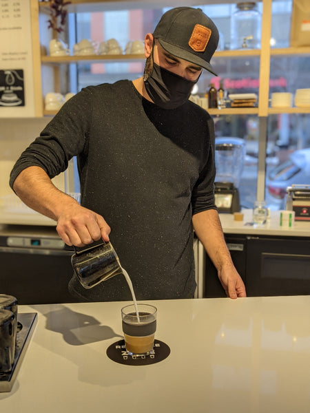 Barista Pours Milk