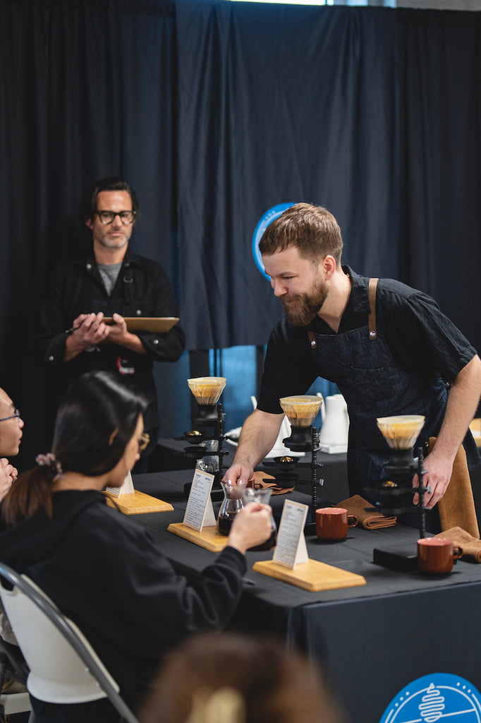 AJ Doell Presenting his coffee to the Brewers Cup Judges